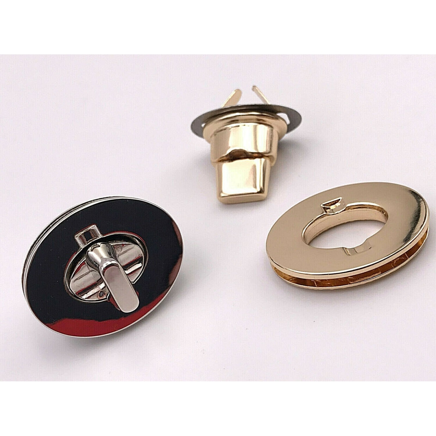 CHIUSURA OVALE PER RIFINITURE BORSE E ACCESSORI MISURA 3,5X2,7 cm.