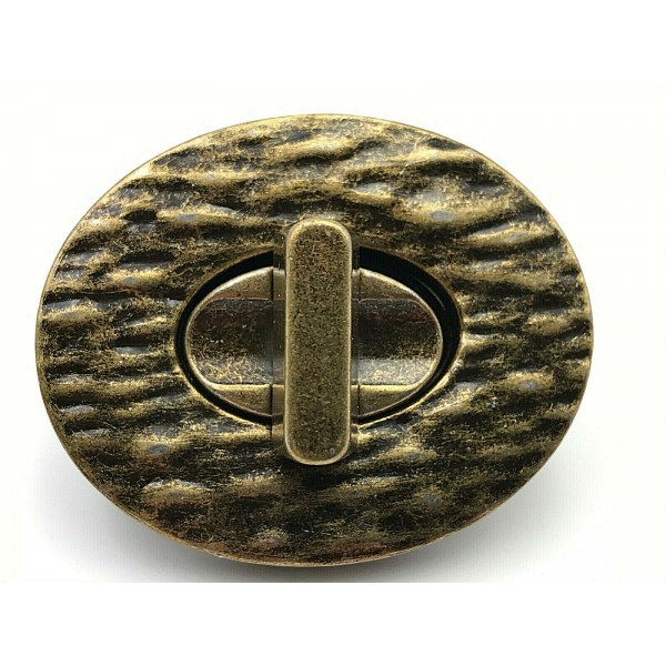 CHIUSURA OVALE LAVORATA PER RIFINITURE BORSE E ACCESSORI MISURA 4,6X3,7 cm.