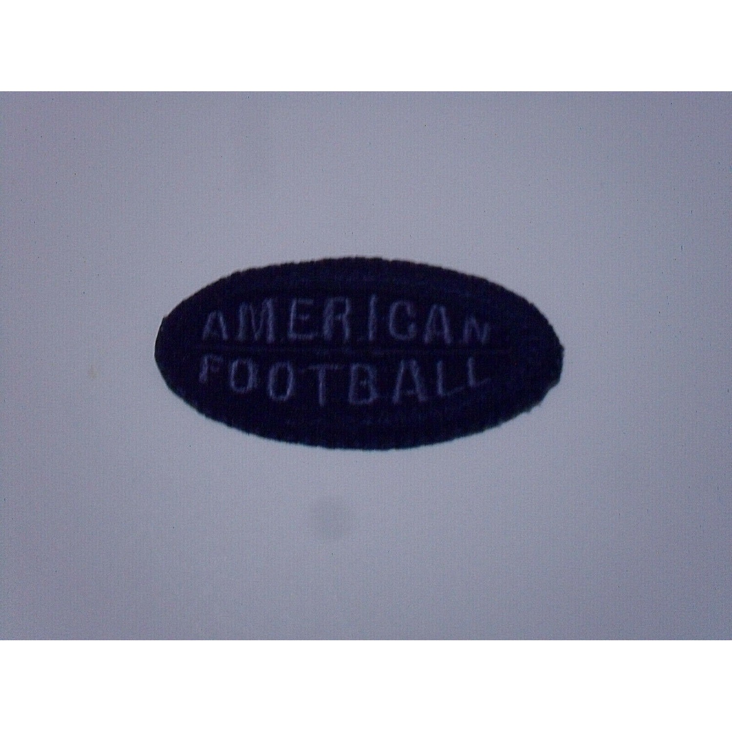 TOPPA PATCH RICAMO TESS. "AMERICAN FOOTBALL" TERMO O DA CUCIRE DIMENS. 6X3,2 CM.