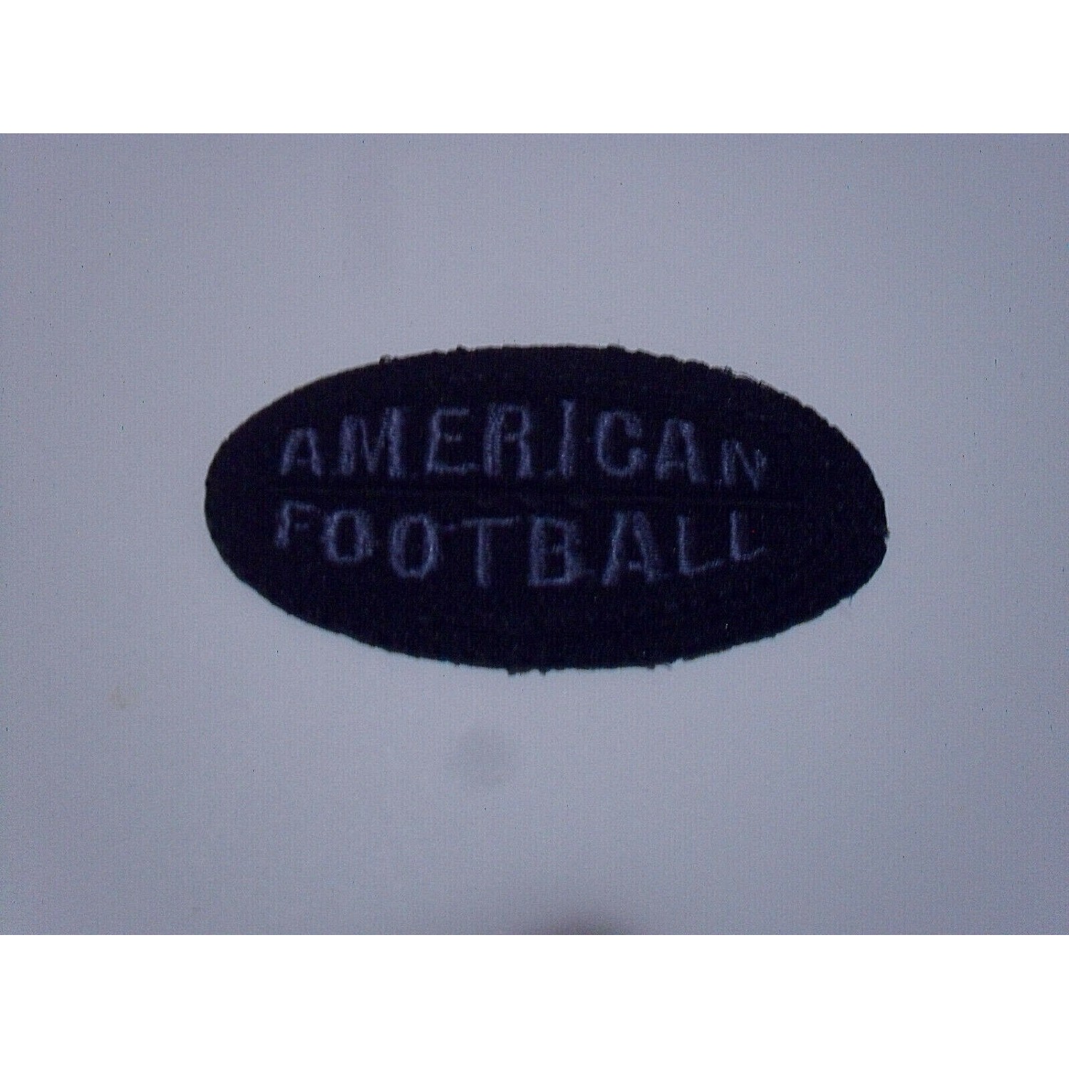 TOPPA PATCH RICAMO TESS. "AMERICAN FOOTBALL" TERMO O DA CUCIRE DIMENS. 6X3,2 CM.